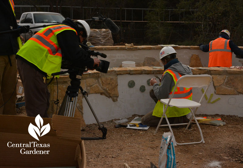 W. Gary Smith landscape architect installing tiles in the Luci & Ian Family Garden 