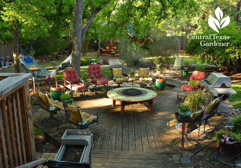 Colorful backyard patio room with handmade fire pit by Sol'stice Garden Expressions