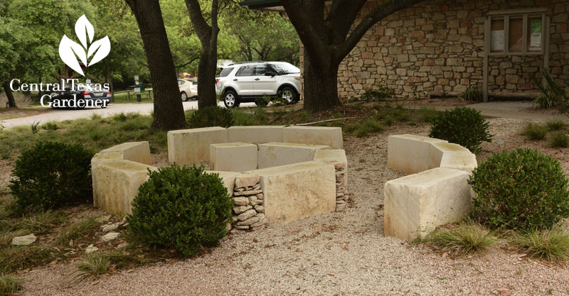 limestone spiral seating under oak trees Rollingwood City Hall Central Texas Gardener