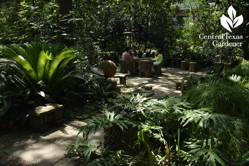 Shady front garden with faux bois furniture Central Texas Gardener