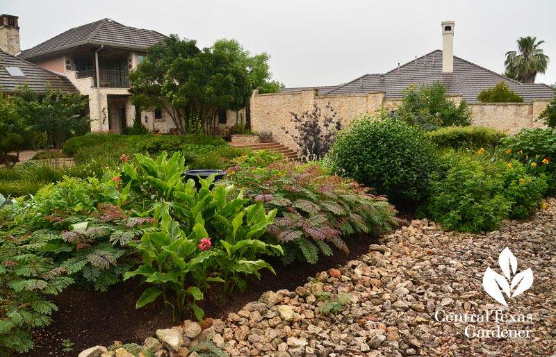 dry creek bed swale plant berms Central Texas Gardener