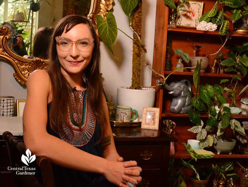 woman with plants on dresser