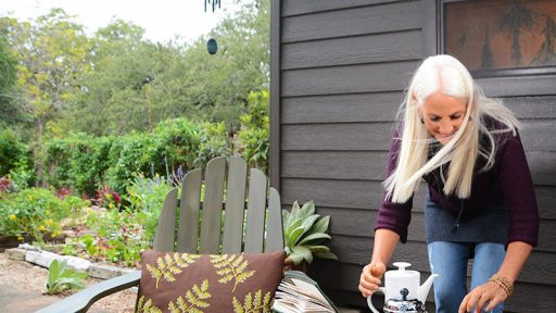 woman pouring tea at outside table