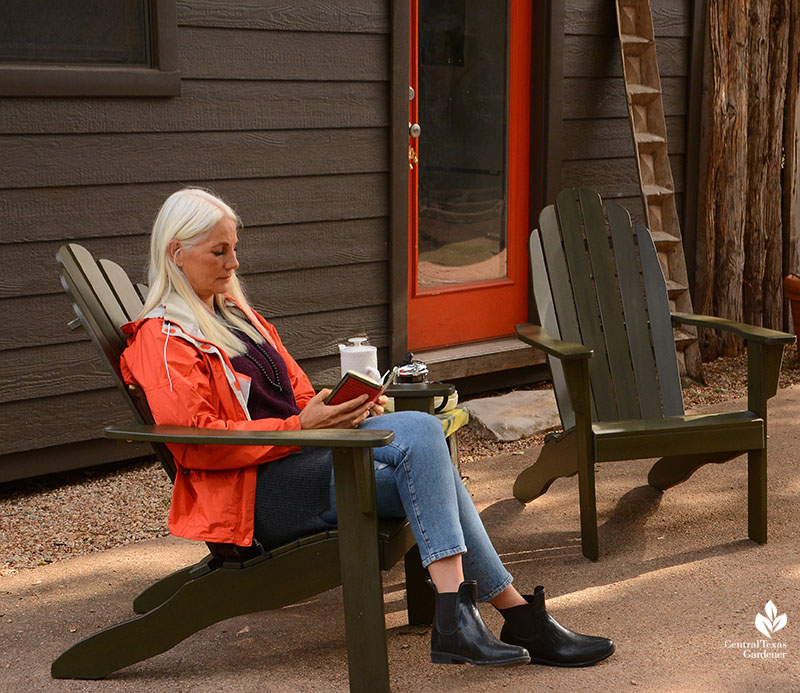 woman sitting in chair outside 