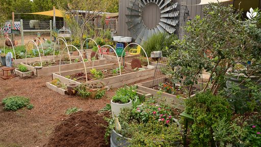 Raised vegetable beds salvaged windmill garden art Julie Nelson Kay Angermann