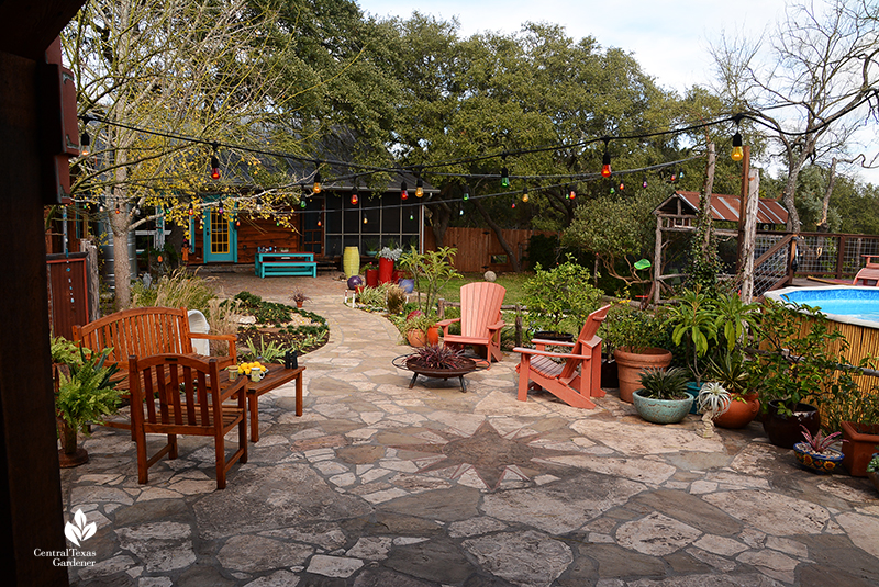 Flagstone patio outdoor furniture containers path to house Dromgoole garden Central Texas Gardener