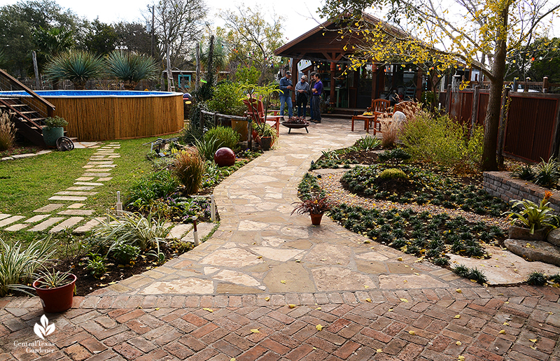 brick patio to flagstone path containers lawn greenhouse Jane and John Dromgoole garden