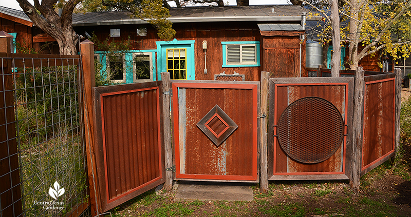 recycled galvanized panels and gate for screening Jane and John Dromgoole garden Central Texas Gardener