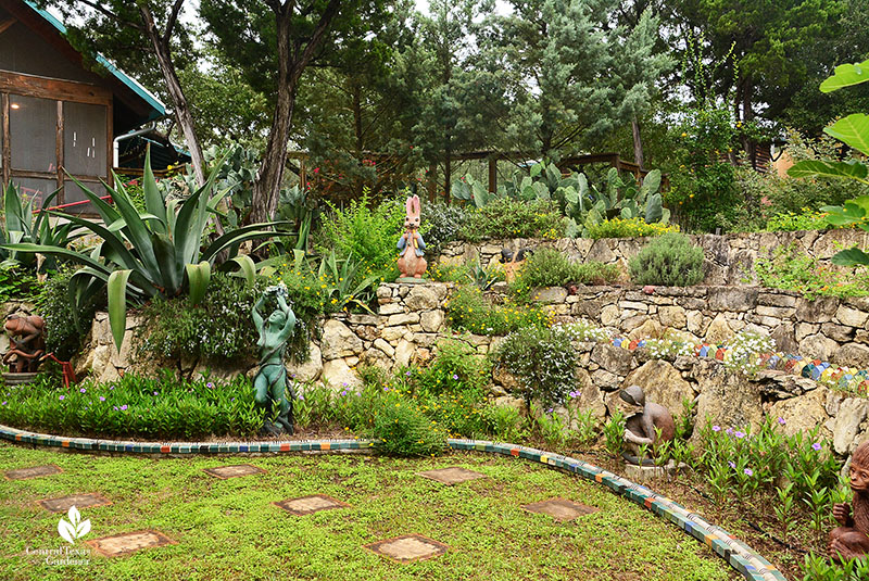 Rock wall tiers drought tough plants artistic tiles sculpture Claudia Reese Central Texas Gardener
