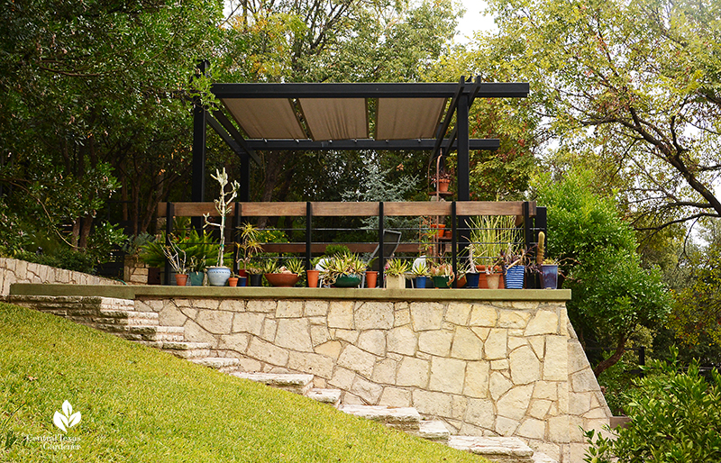 elevated limestone pavilion backyard outdoor room on hard slope Harper Duhon Central Texas Gardener