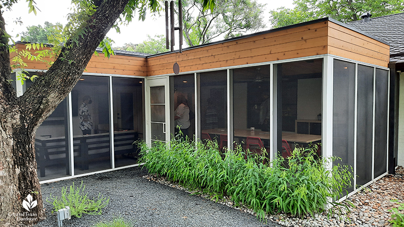 screened in porch native inland sea oats native river rock and Texas basalt path around pecan tree Open Envelope Studio