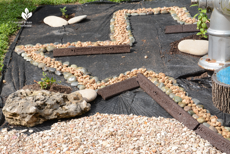 texas shape with rocks on lawn 