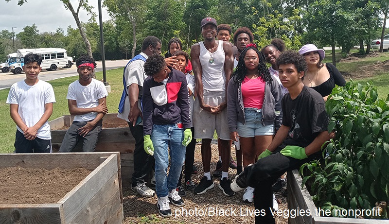 kids with man at community garden