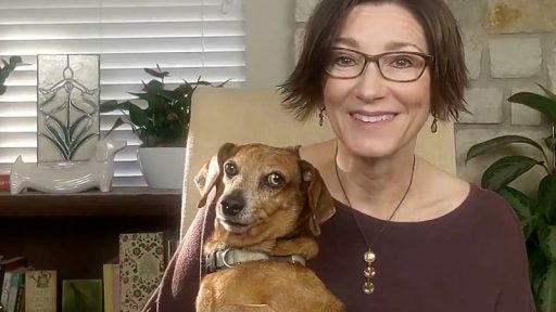 woman and dachshund in living room