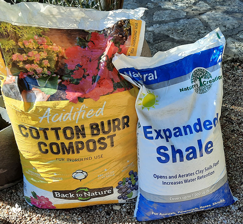 bags of cotton burr compost and expanded shale 