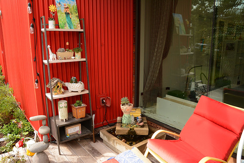 patio nook small fountain shelf with plants and art