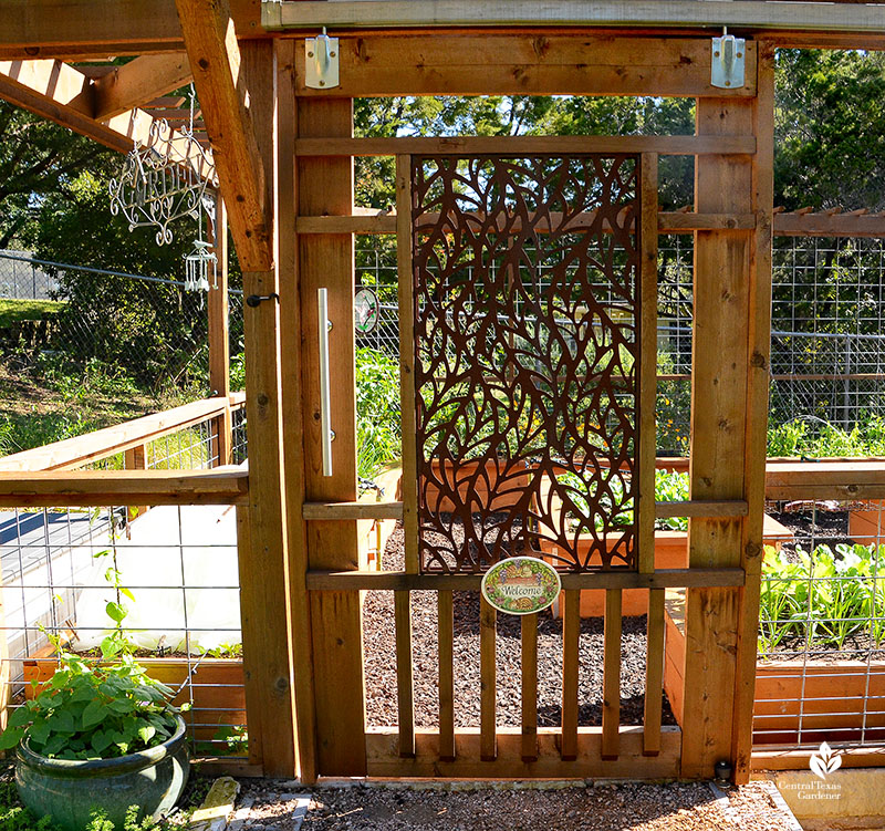 decorative metal panel cedar sliding barn door garden entrance