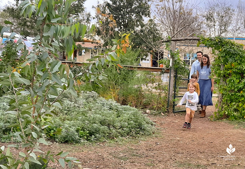 family coming into garden