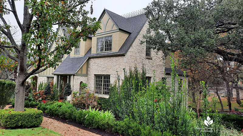 Tudor style house with plants 