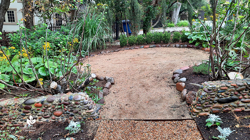 gravel patio framed by plants