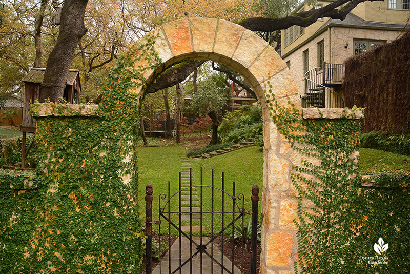 stone arch and gate to backyard