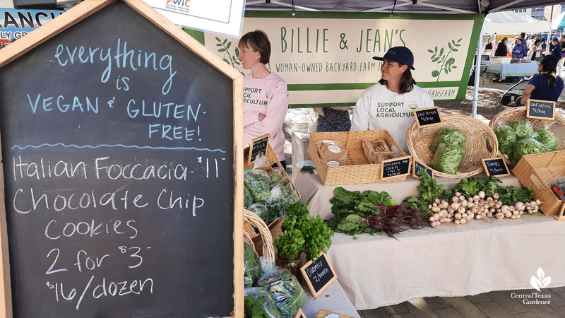 chalkboard and two woman at farm stand