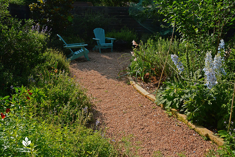 decomposed granite path between flowers to two chairs