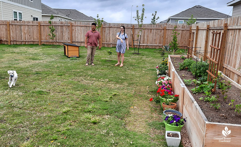 man woman and dog in backyard