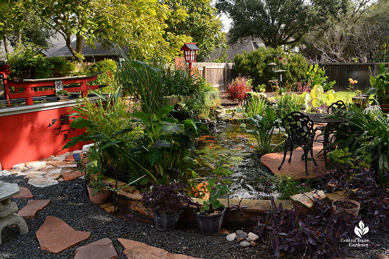 ground and above ground ponds rock path bistro table plants