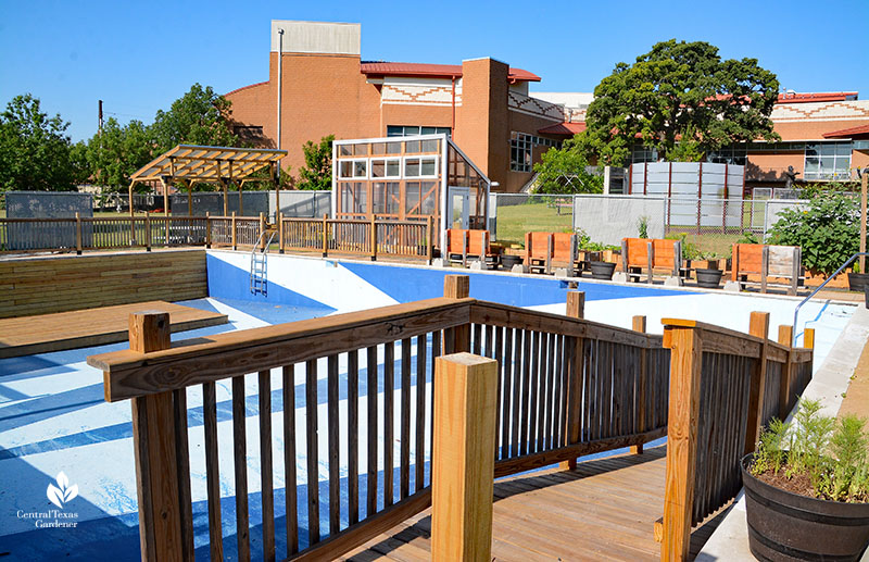 wooden ramp to empty swimming pool 