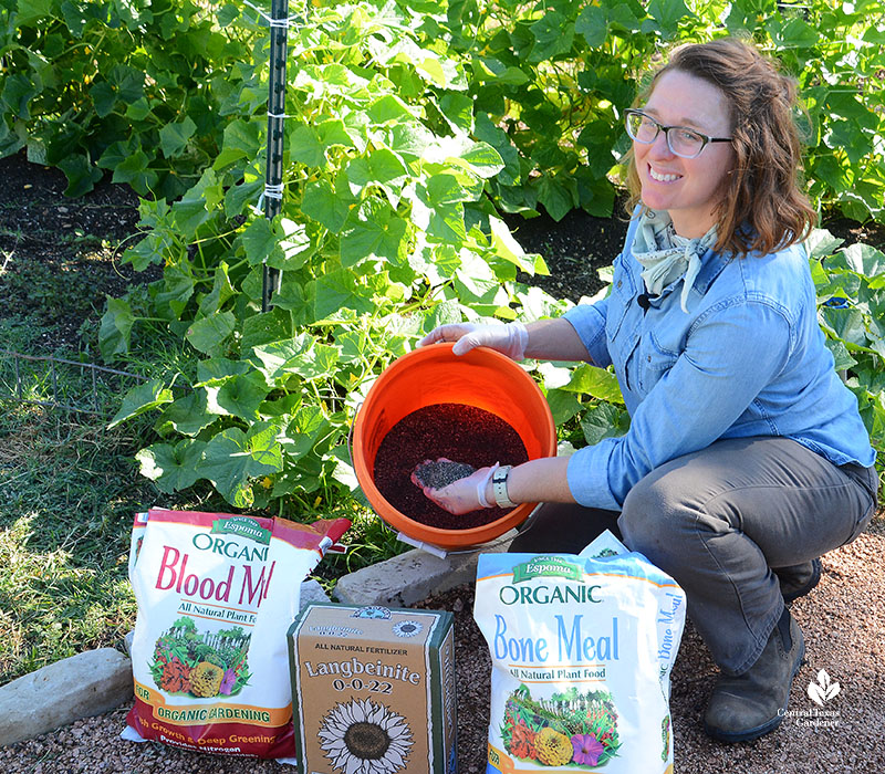 woman  with fertilizer and bucket