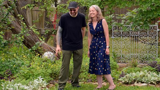 man and woman laughing in garden