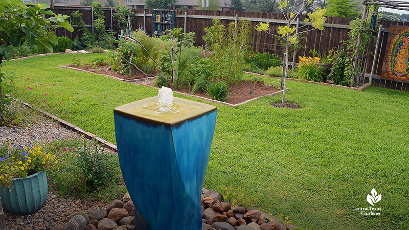 disappearing fountain and garden and lawn behind