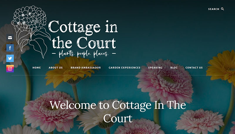 web page deep turquoise background; pink and orange flowers; white text: Cottage in the Court