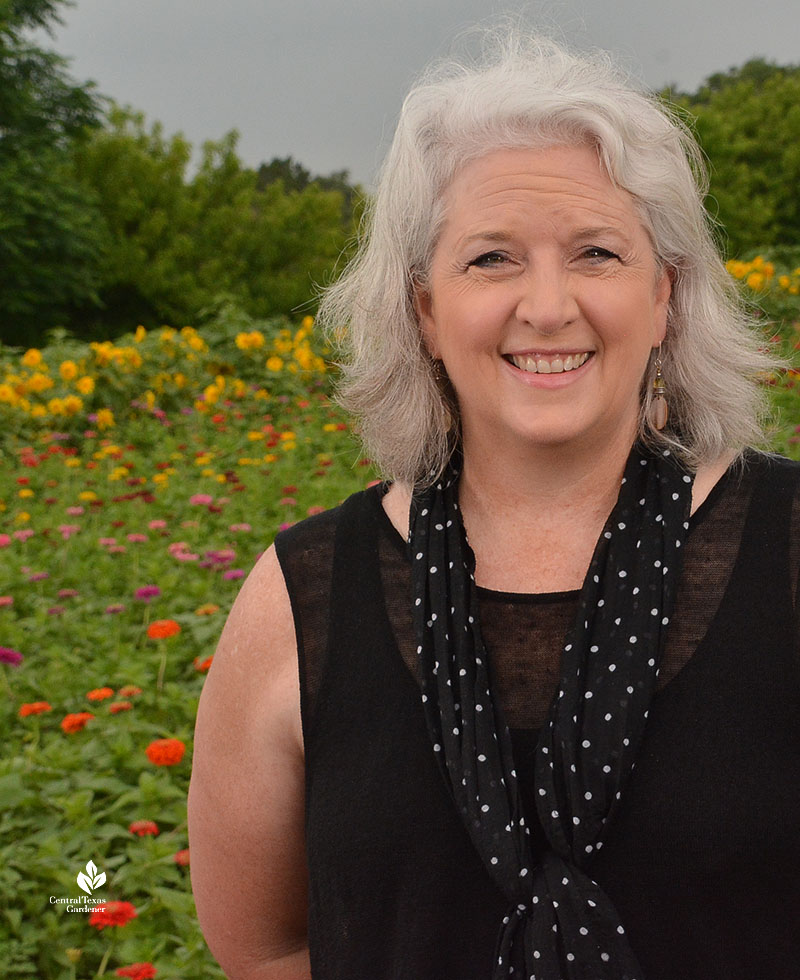 woman smiling in field of flowers