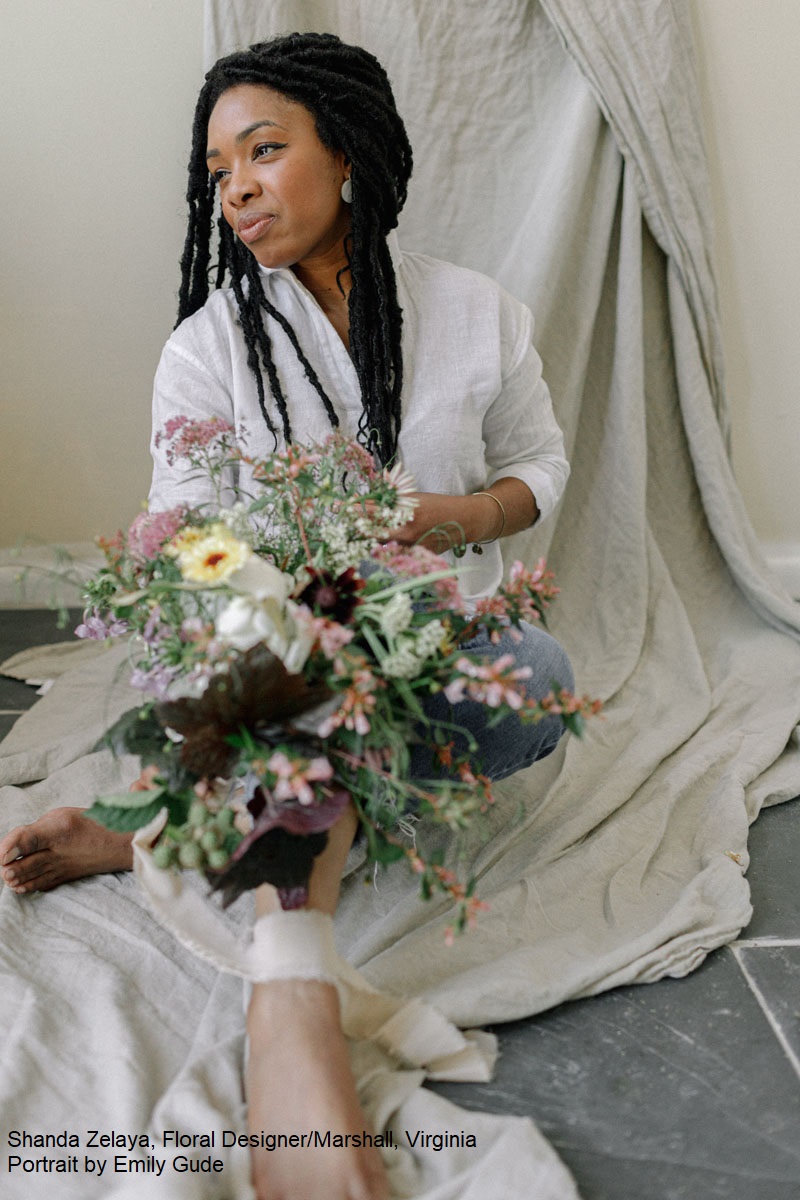 woman holding lovely arrangement of flowers