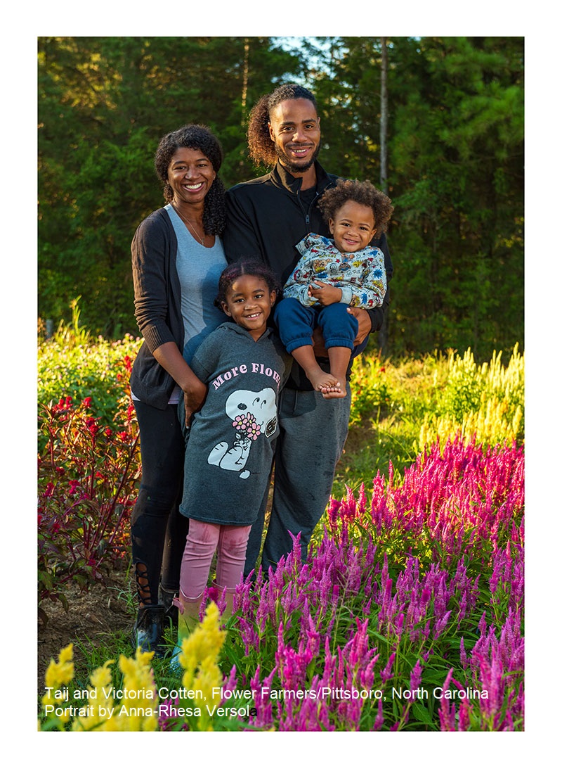 young couple with small children among flowers