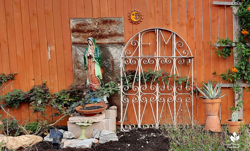 Lady of Guadalupe figurine and gate