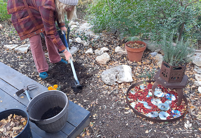 woman digging into soil