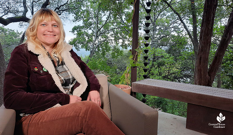 smiling woman with garden behind