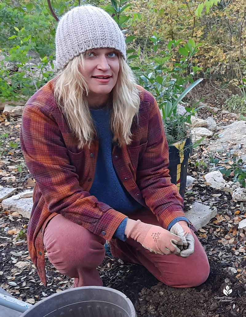 woman kneeling on soil 