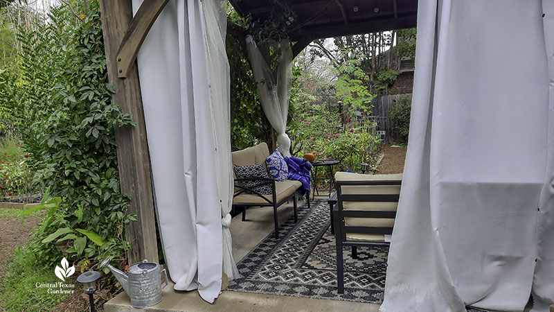 cabana in garden framed by drapes 