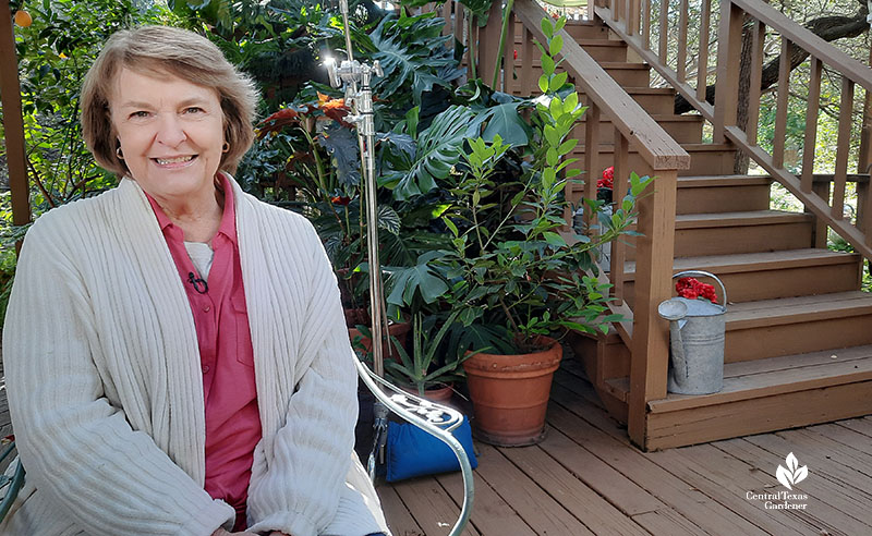 smiling woman sitting on deck