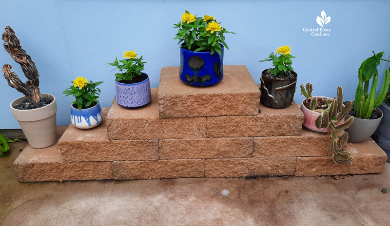 ceramic containers and designs with flowers sitting on patio concrete block design 