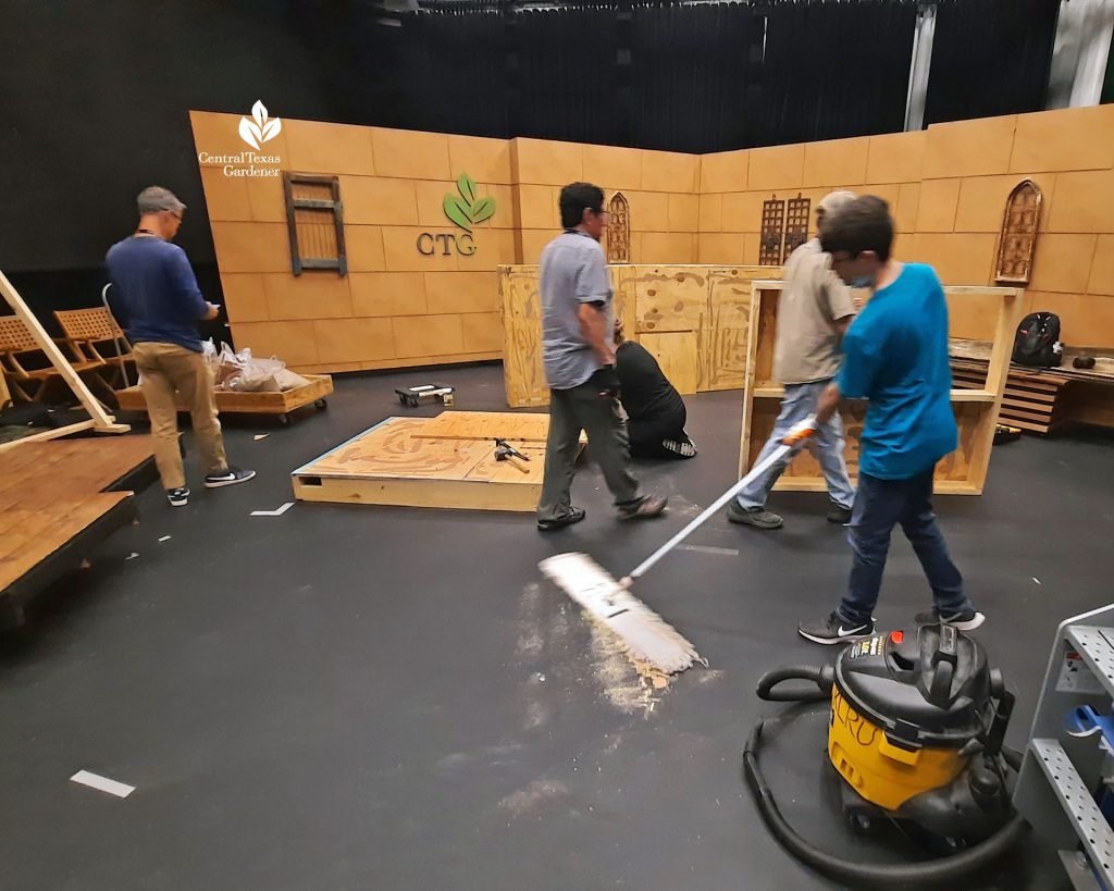 TV crew sweeping studio floor 