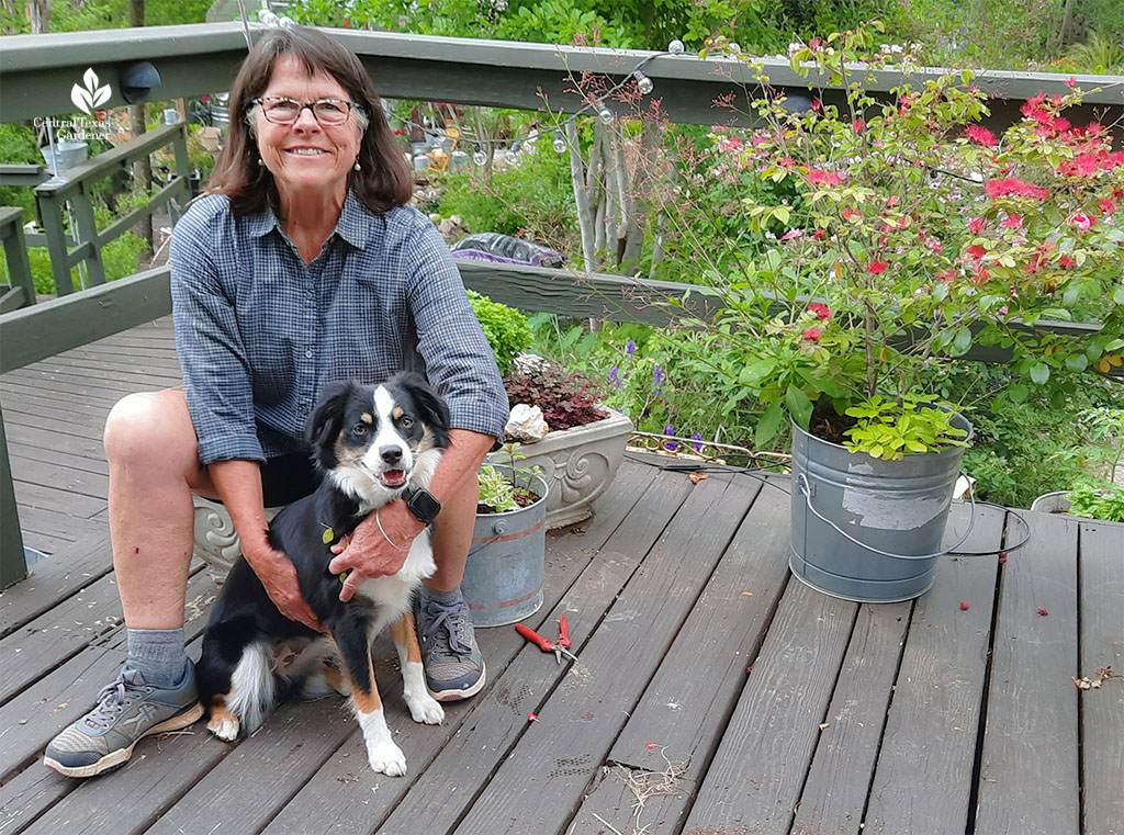 smiling woman and cute black and white dog 