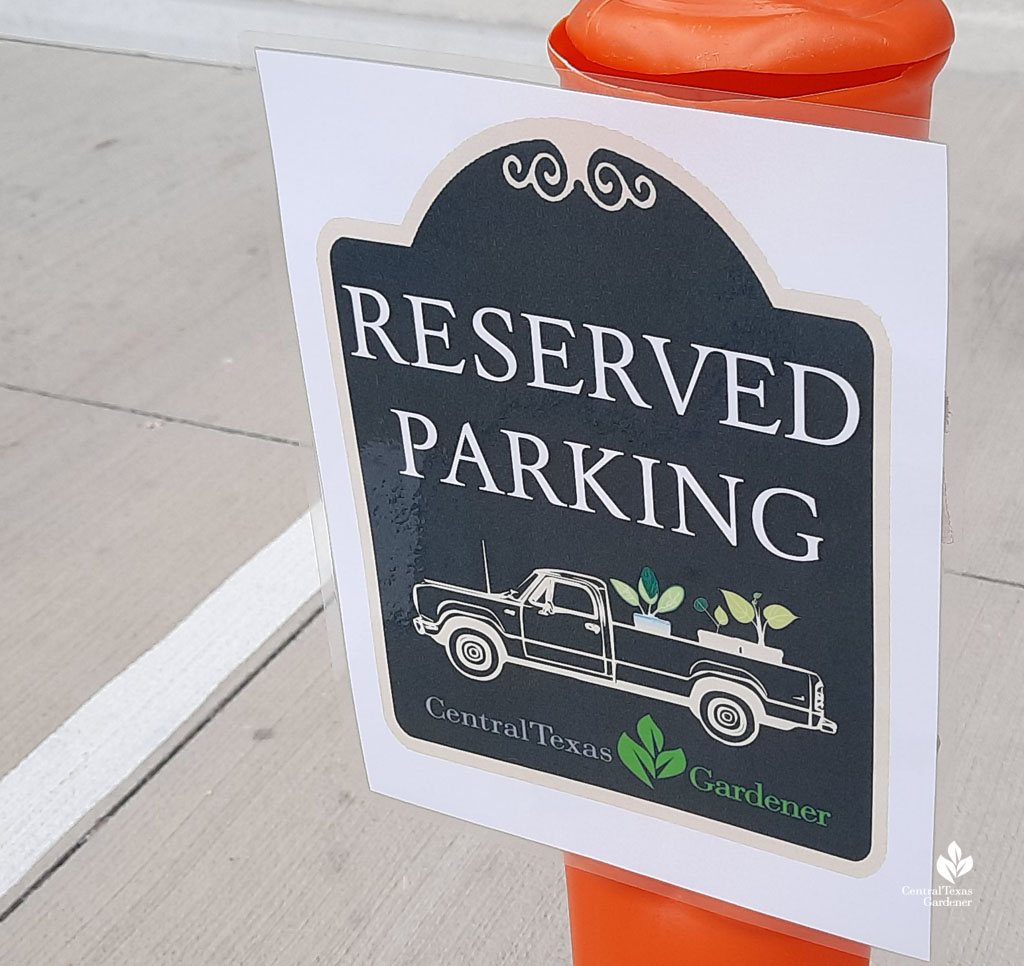 paper sign: Reserved Parking with drawing of vintage truck holding plants 