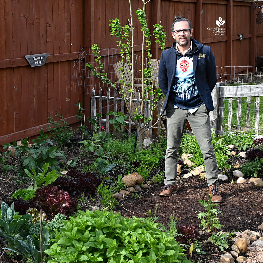 man standing on blank ground in garden