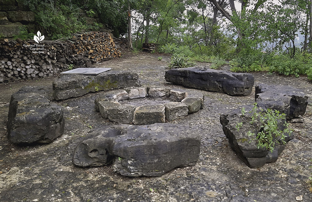 stone firepit framed by stone "benches" 