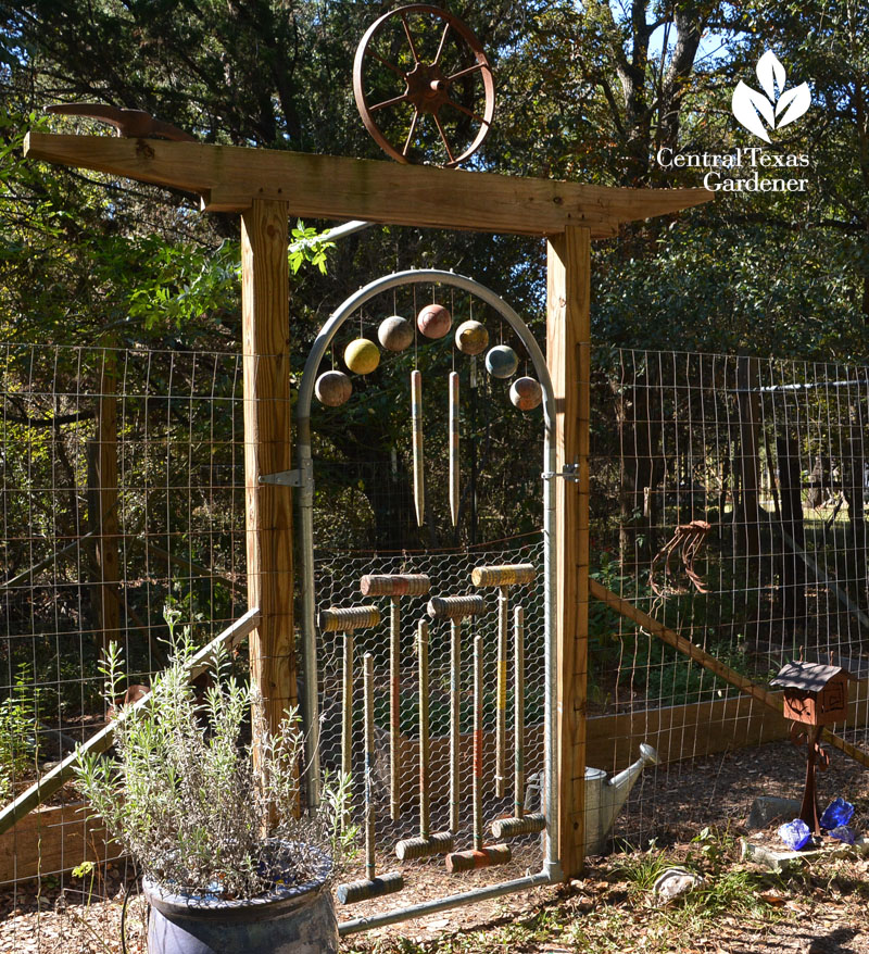 croquet balls and mallets designed into garden gate door 